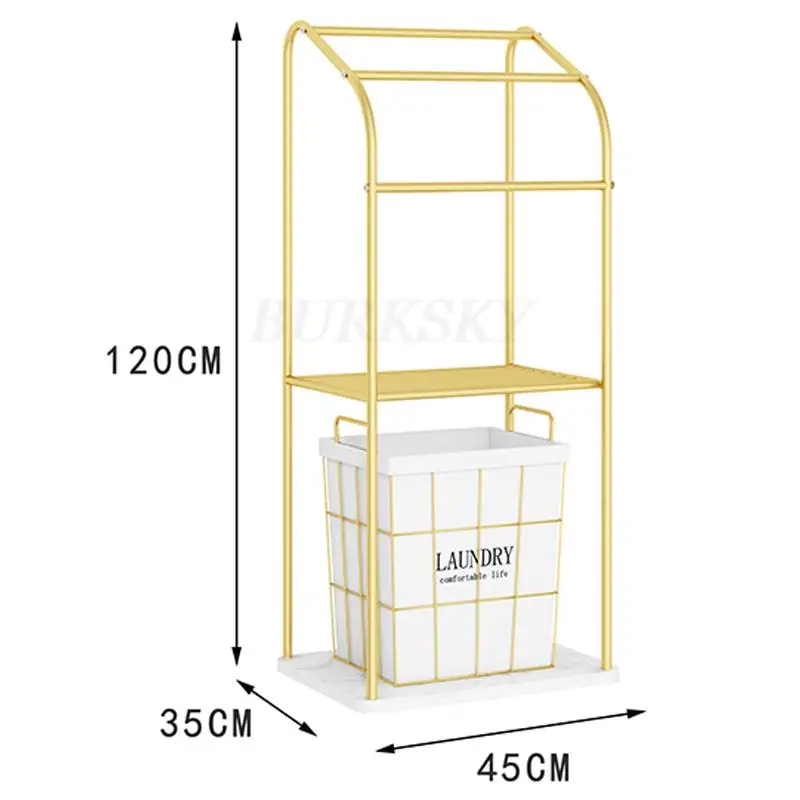 Porte serviette sur pieds en métal doré avec étagère