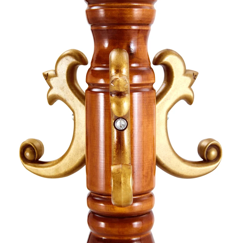 Portemanteau sur pied baroque en bois verni et détails dorés avec panier vide-poche et crochets sculptés MYSTICORA