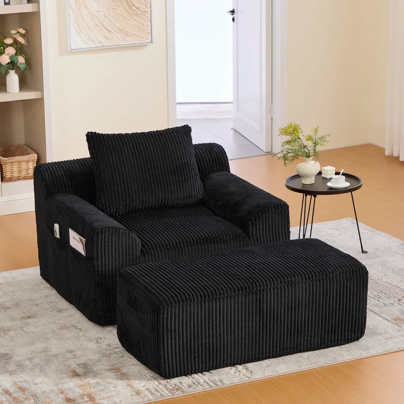 Canapé simple fauteuil XXL en velours côtelé noir, dossier profond, repose pied, coussin & poches latérales, sans montage CHROMONET