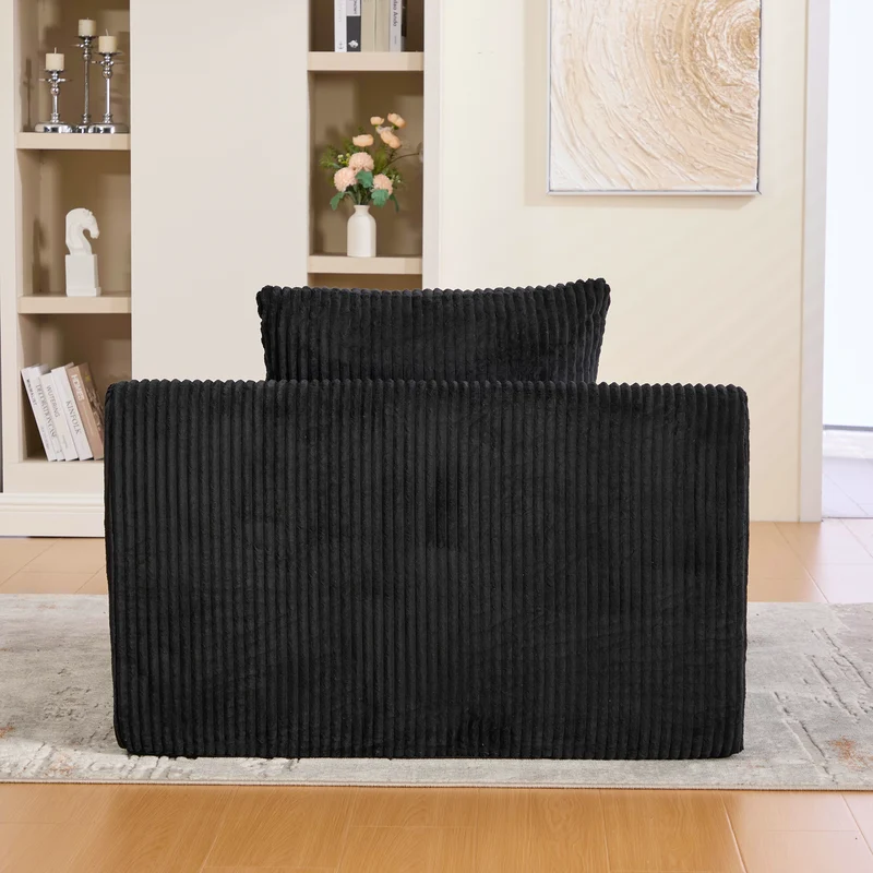 Canapé simple fauteuil XXL en velours côtelé noir, dossier profond, repose pied, coussin & poches latérales, sans montage CHROMONET