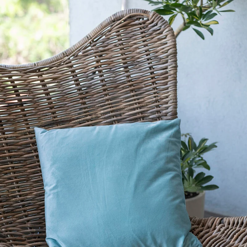 Contemporary Scandinavian Handwoven Rattan Lounge Chair - Accent Chair With Ergonomic Backrest & Iron Base For Boutique Indoor & Outdoor Spaces